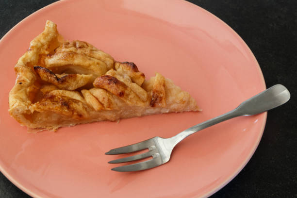 istock Piece of apple tart on a plate 1159261514
