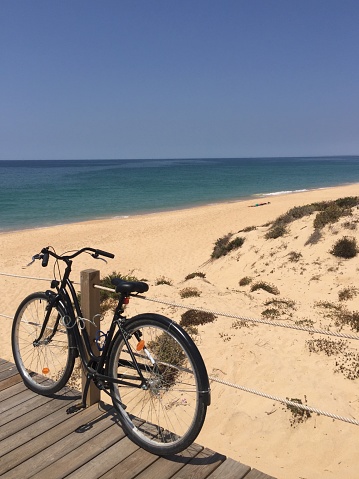 A bicycle on an empty beach in Portugal