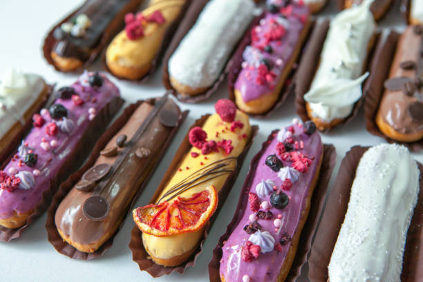 istock Set of several eclairs with various fillings and design isolate on a white background, the concept of French cuisine 1159264640