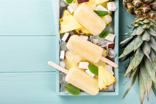 istock homemade pineapple coconut popsicles 1159266872