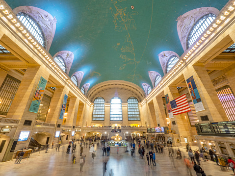New York City, USA - April 28, 2019: Commuters and tourists in the Grand Central Station. It is the largest train station in the world by number of platforms (44).