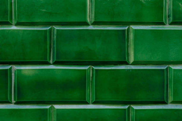 Detail of a ceramic wall in intense green color stock photo