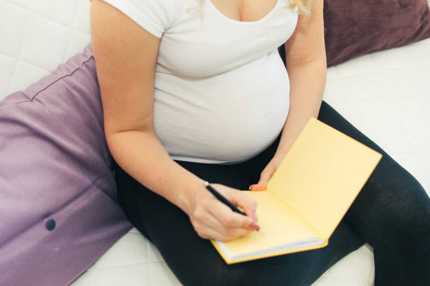 istock Pregnant woman taking notes 1159270398