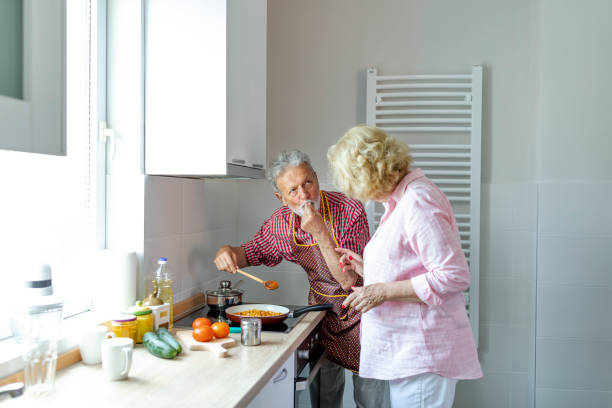 istock Senior couple preparing lunch 1159275301