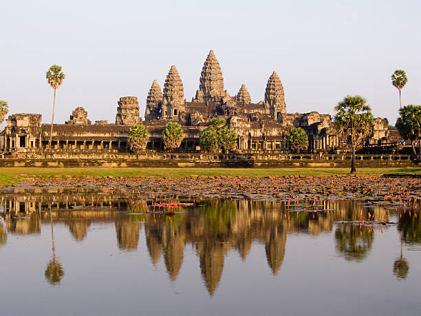 istock Angkor Wat temple reflected in lotus pond at sunset, Cambodia 115927620