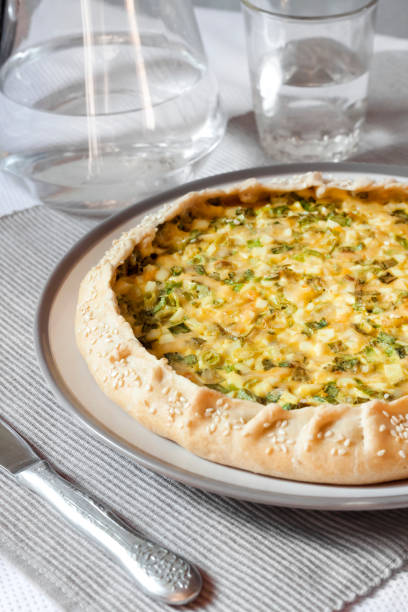 istock Tart with eggs and green onions on a plate 1159276513