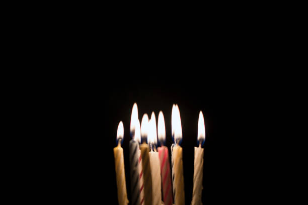 Birthday candles glowing in the dark