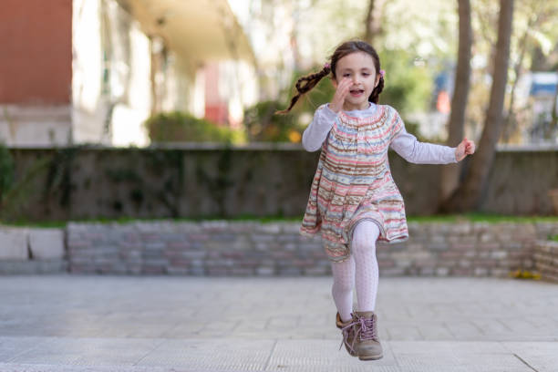 istock little girl running 1159280256