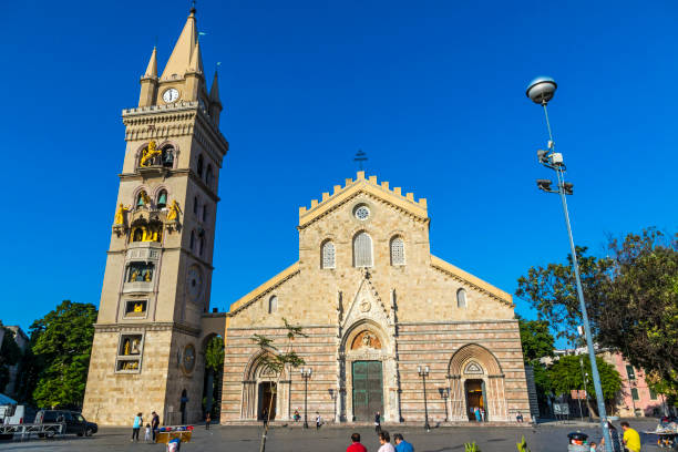 Messina, Italy - May 13, 2018: Messina Cathedral (Duomo di Messina) is a Roman Catholic cathedral located in Messina city, Sicily, Italy. Clock tower has the largest astronomical clock in the world