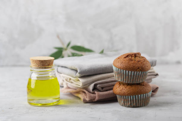 Different products from marijuana. Baking muffins from cannabis, natural CDB fabric and oil Different products from marijuana. Baking muffins from cannabis, natural CDB fabric and oil. Gray background bud candy stock pictures, royalty-free photos & images