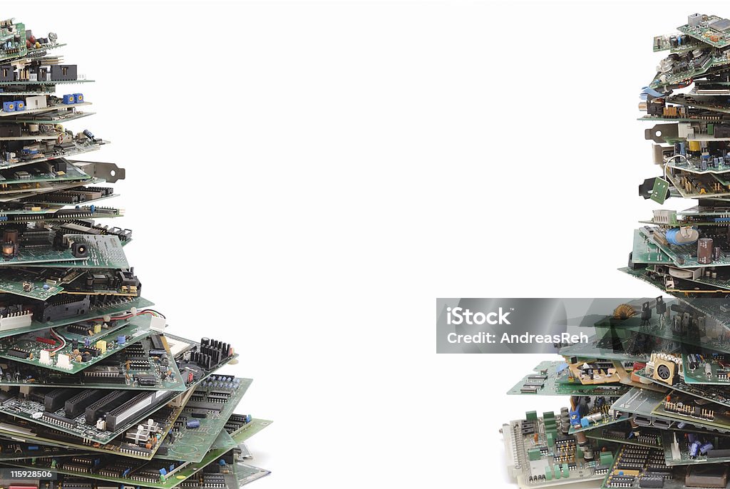 Bunches of computer hardware Electronic waste, a lot of circuit boards on stacks. Space between it for your text. Electronics Industry Stock Photo