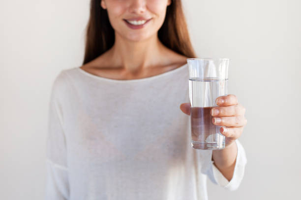 istock Young woman drinking water 1159288858