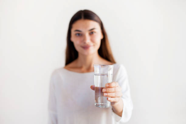 istock Young woman drinking water 1159288990
