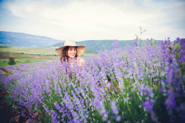 istock Smiling woman at lavender field 1159289752