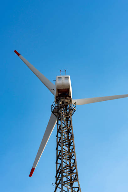 istock The wind turbine power working, blue sky, energy power concept 1159291727