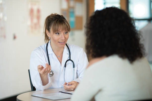 istock Doctor speaking to patient 1159291765