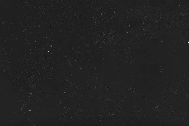 istock dust scratches black background white lights 1159292186