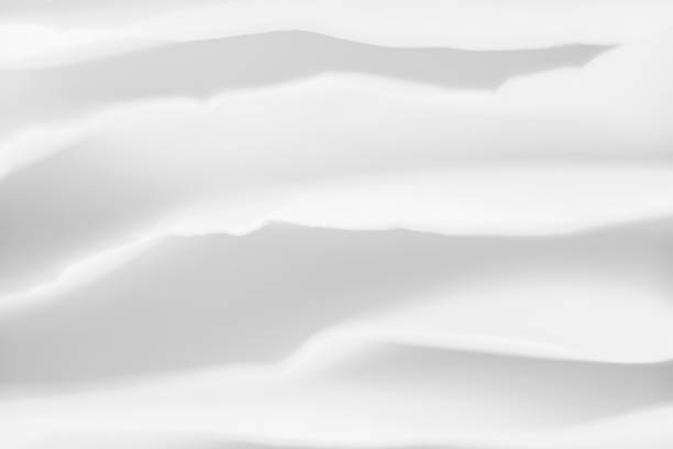 istock white paper layers background gray wavy shadow 1159292198