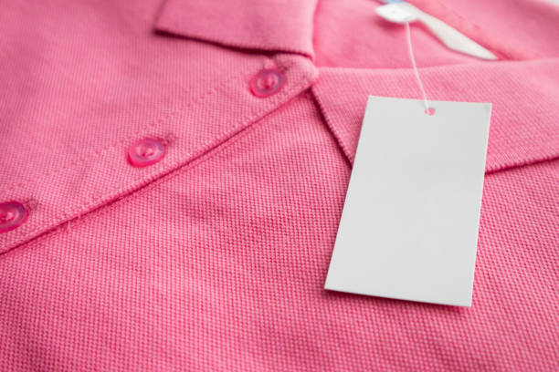 istock Blank white clothes tag label on new shirt 1159293402