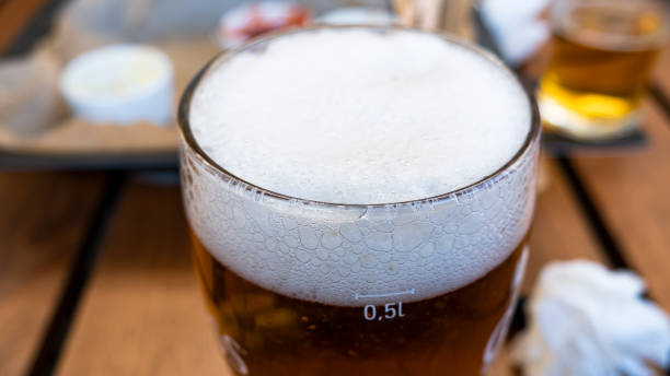 istock Glass of light beer on a pub background. Close up 1159293701