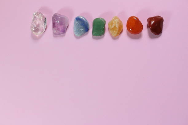 istock Chakra healing stones and one leaf on pink millennial background with copy space for text 1159298233