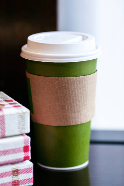 istock Morning coffee on a Christmas day and gift boxes on a wooden table 1159300087