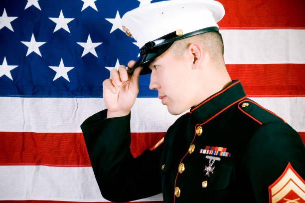 istock Marine in front of a US flag 115930391