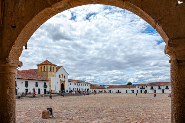 Villa de Leyva, Colombia - Church On The Cobblestoned Plaza Mayor Of The Historic 16th Century Colonial Town As Viewed from The Northern Corner In Morning Sunlight stock photo