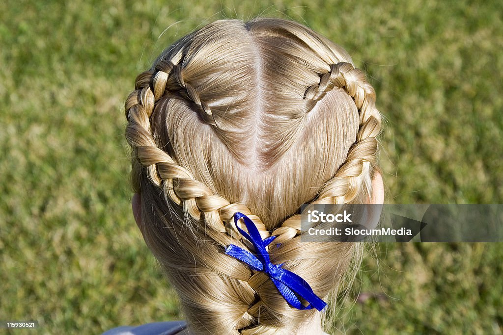 Braided Heart Young girl shows off her hair braided into a heart shape. Braided Hair Stock Photo