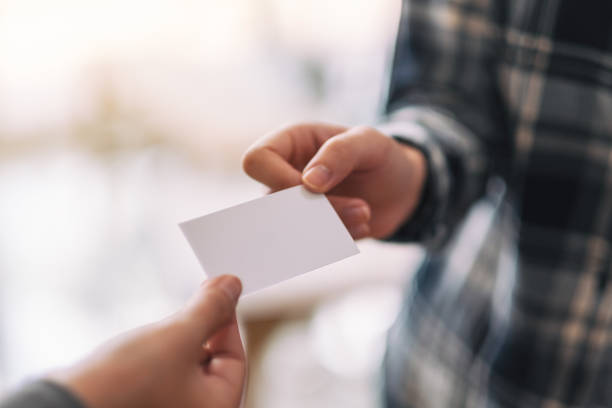 istock businessman holding and exchanging empty business card 1159306191