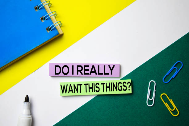 istock Do I Really Want This Thing? text on sticky notes with office desk concept 1159307150