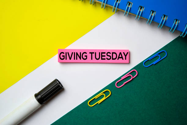 istock Giving Tuesday text on sticky notes with office desk concept 1159307236