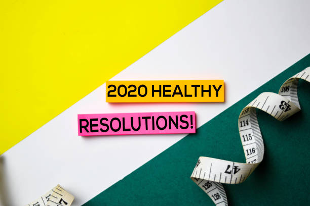 istock 2020 Healthy Resolution! text on sticky notes with office desk concept 1159307843