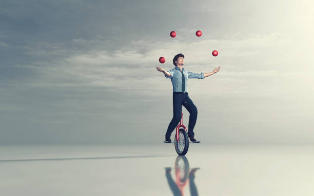 business man rijden eenwieler en jongleren met een aantal ballen. 3d render - jongleren stockfoto's en -beelden