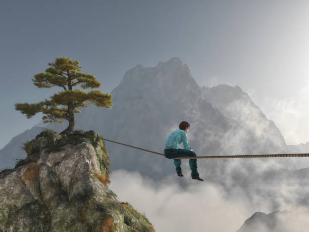 istock Thoughtful man sitting on rope at high altitude between mountains. 3d render 1159308888