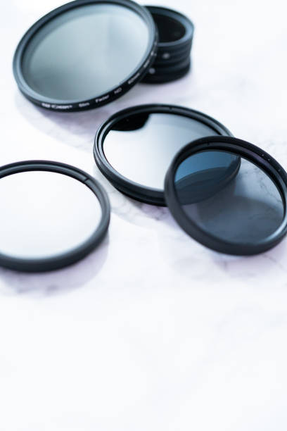 istock Polarized and neutral density filters on a white table. 1159308958
