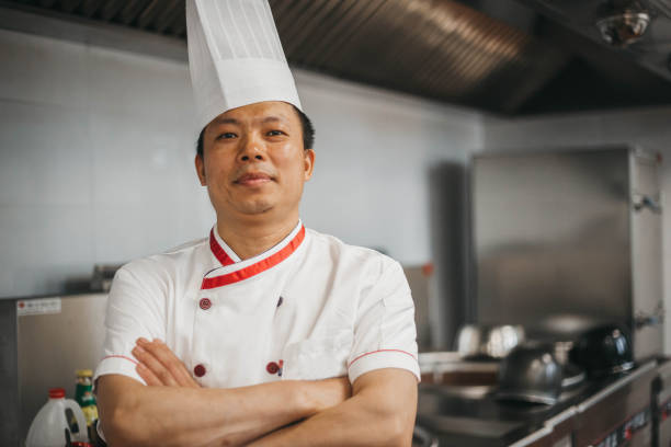 istock Chinese chef preparing food 1159313104