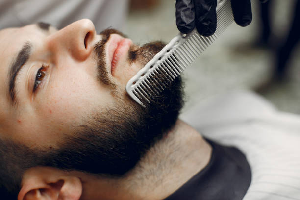 istock Stylish man sitting in a barbershop 1159318671