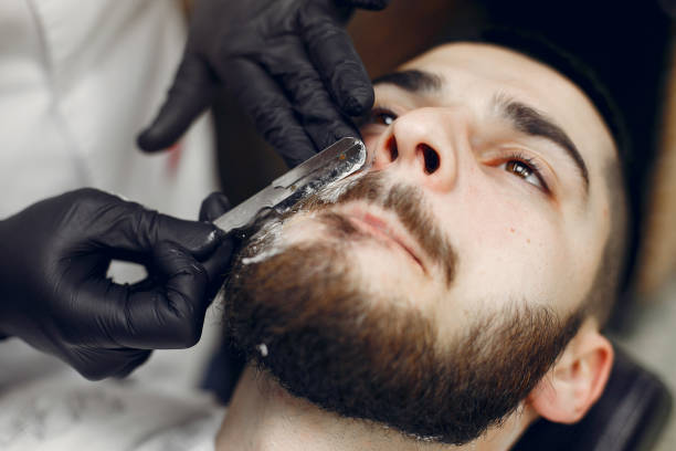 istock Stylish man sitting in a barbershop 1159320507