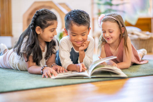 istock Kids reading on the floor 1159321584
