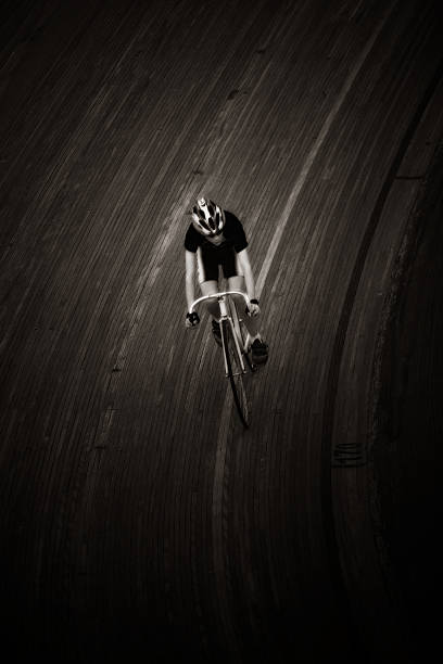 Man Cycling on Road, Sepia Toned