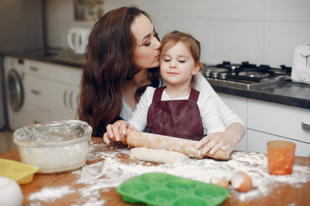 istock Family cook the dough for cookies 1159330128