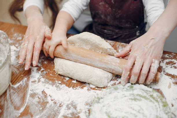 istock Family cook the dough for cookies 1159330134