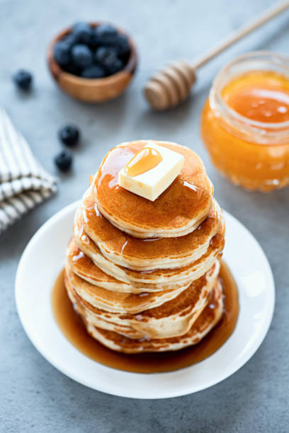 Fluffy Buttermilk Pancakes With Butter And Syrup