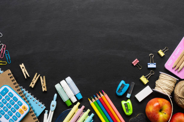 istock Back to School background concept. School supplies on a chalkboard background. Education background concept with copyspace. View from above. Flat lay. 1159331653