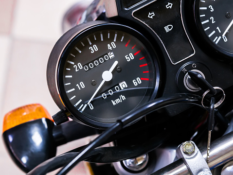 speedometer motorcycle with zero mileage. The bike is in the shop