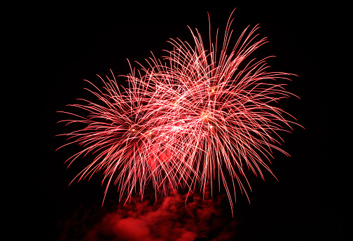 Red fireworks on a dark sky