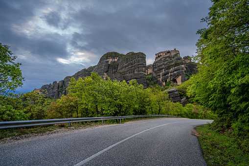 Twisting and turning uphill mountain road leading to the stunningly located Meteora monasteries, Meteora, Greece
