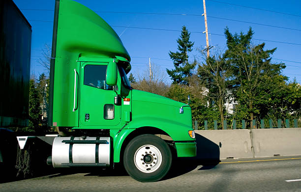 istock Side View of Semi Truck on the Freeway 115933739