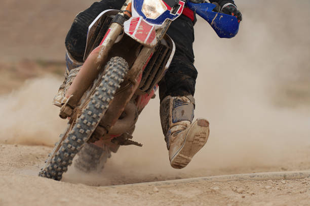 istock Motocross racer accelerating speed in track 1159339473